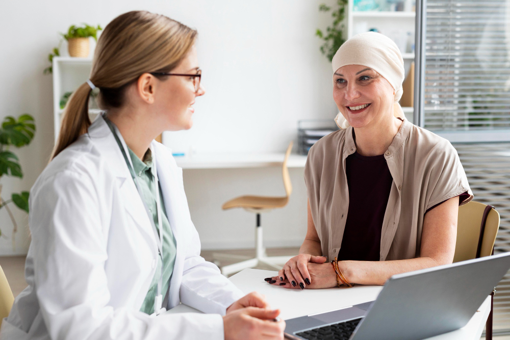 physician speaking to female patient about breast cancer risks